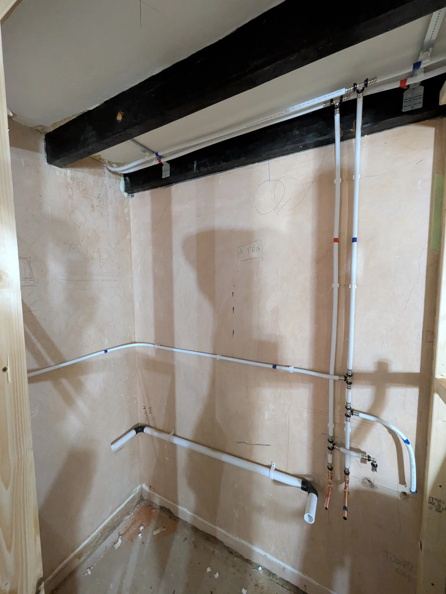 Neat heating pipe runs installed to a wall
