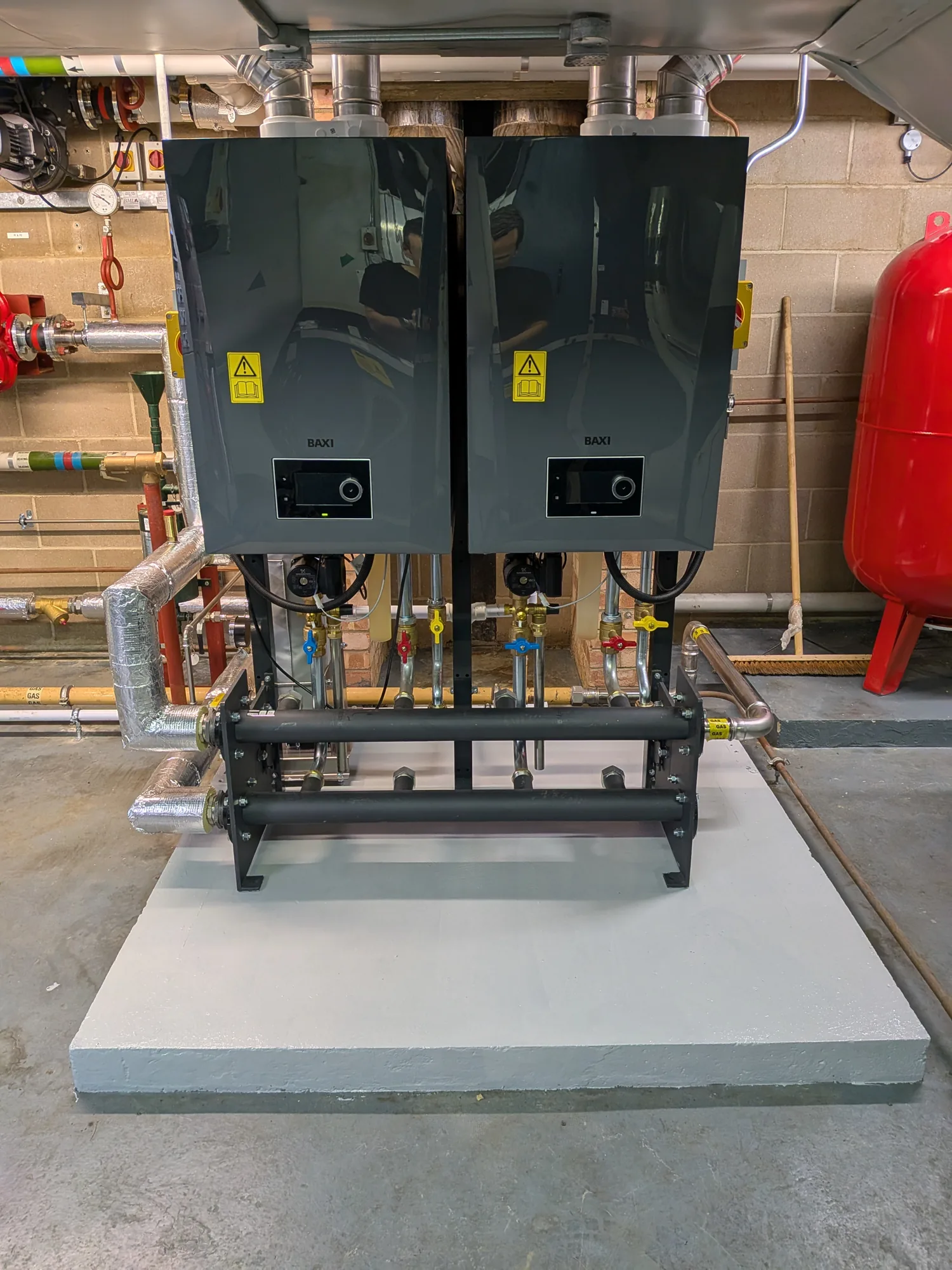 Twin commercial boilers installed on a plant frame
