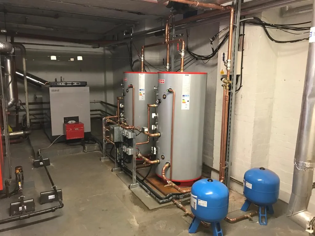 Commercial hot water cylinder and expansion vessels in a plant room