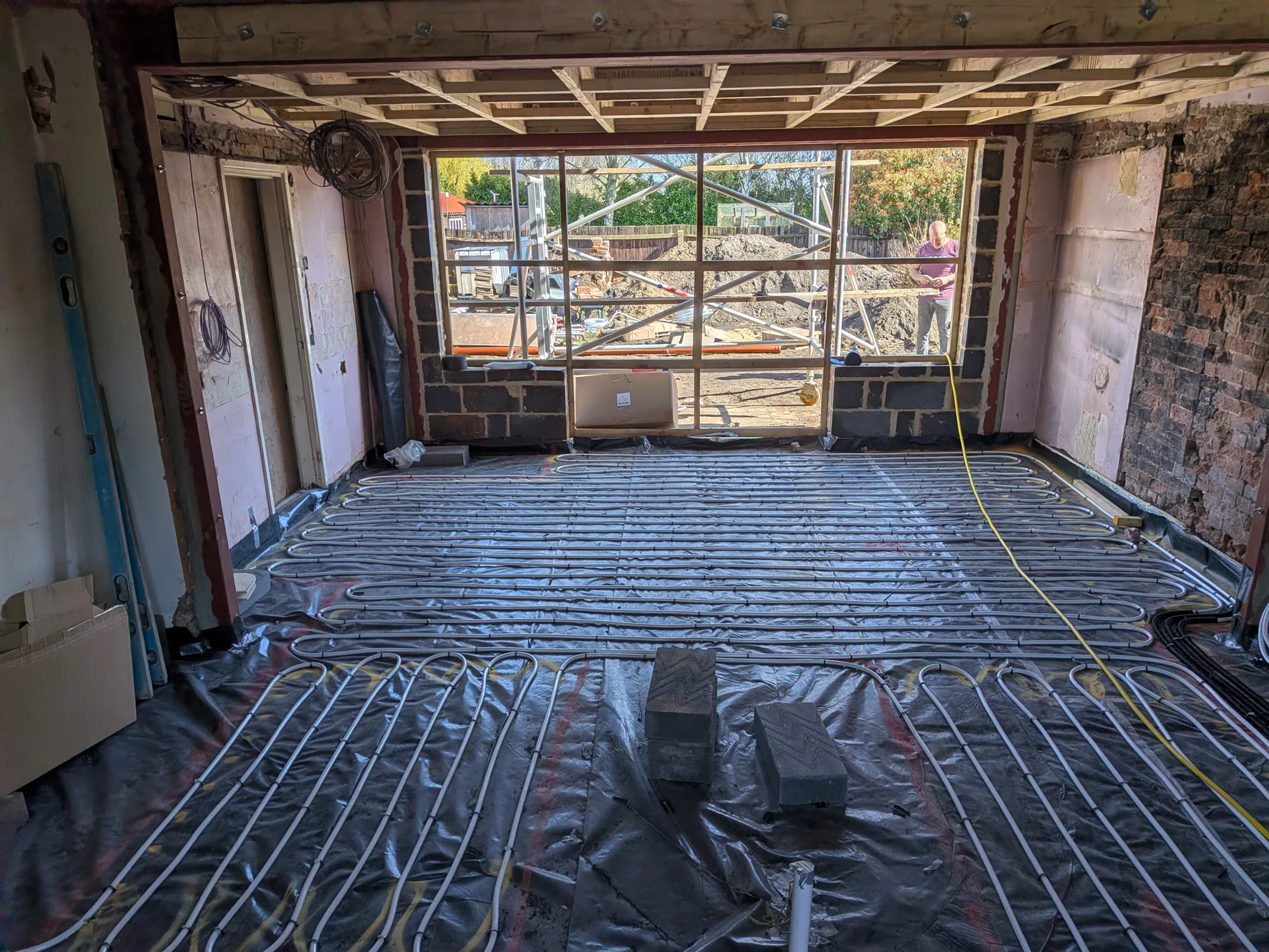 Underfloor heating pipe loops clipped to insulation